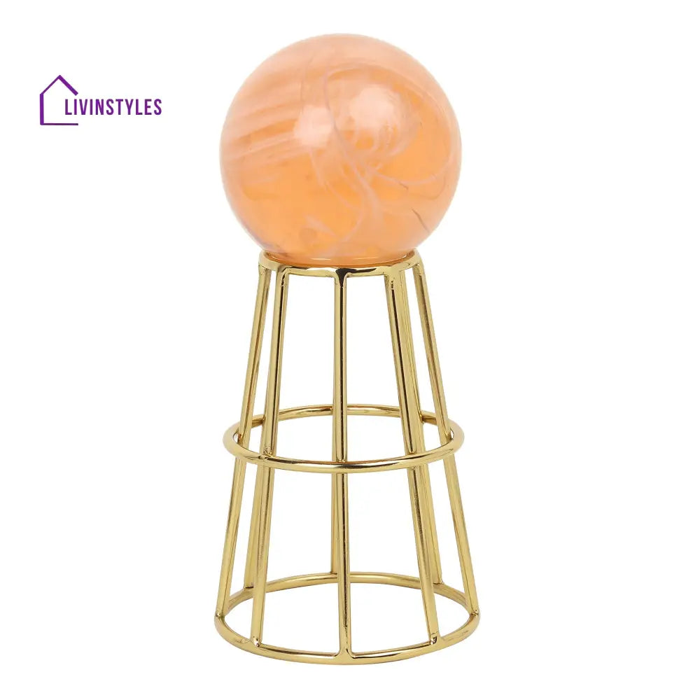 Crystal Orb’s Gold Pedestal With Peach Ball Table Decor