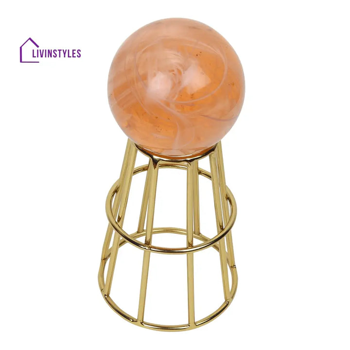 Crystal Orb’s Gold Pedestal With Peach Ball Table Decor