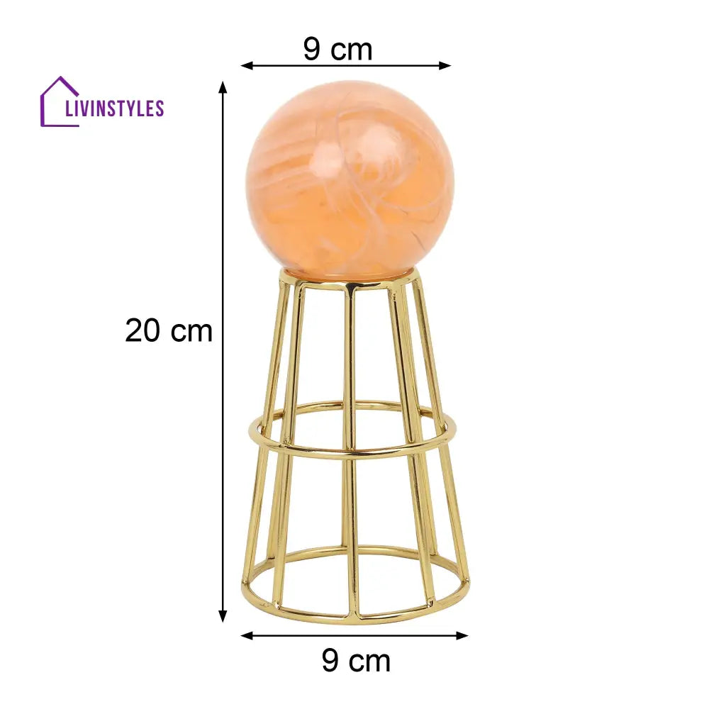 Crystal Orb’s Gold Pedestal With Peach Ball Table Decor