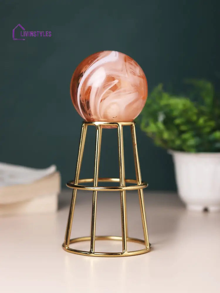 Crystal Orb’s Gold Pedestal With Peach Ball Table Decor