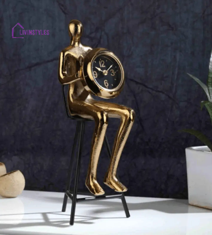 Sitting Man Clock In Gold